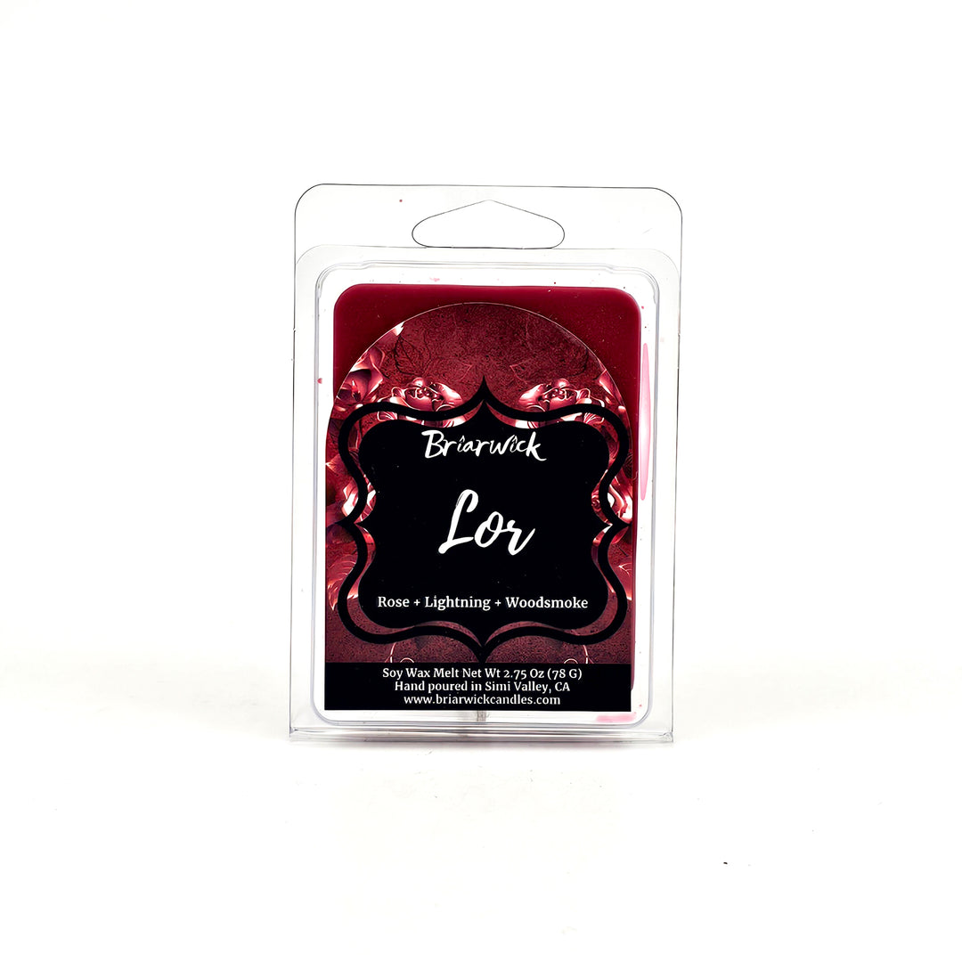 a red candle in a packaging on a white background