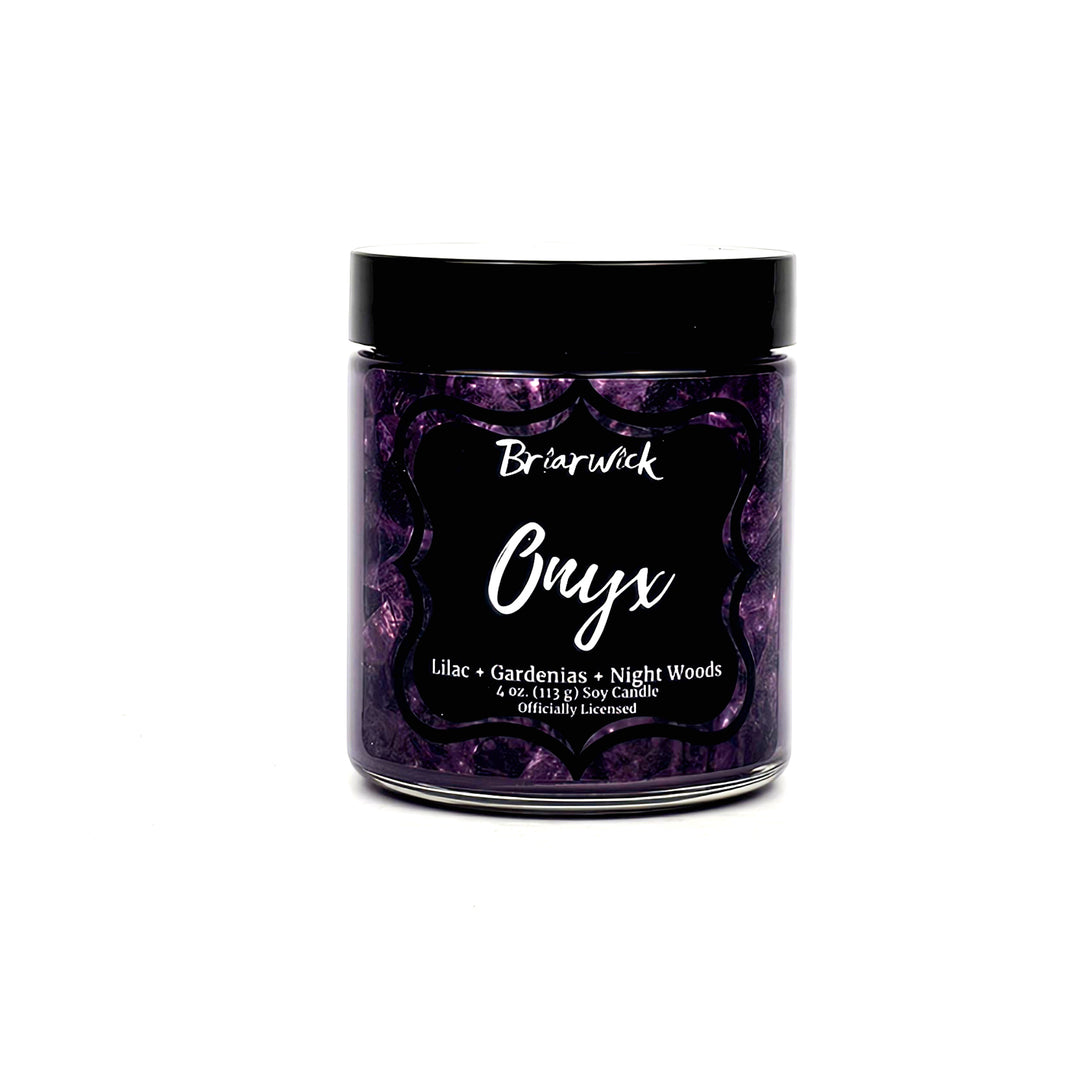 a jar of purple wax on a white background