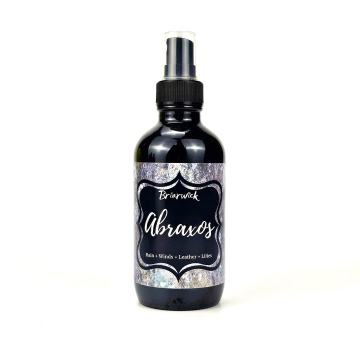 Abroaxos 4oz Linen Spray with gray textured design on a white background