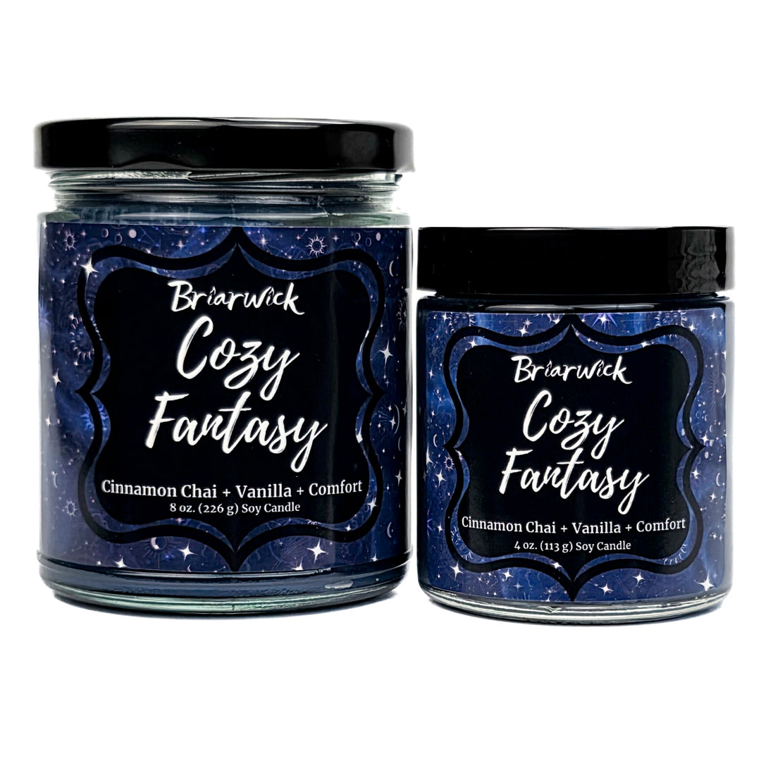 Cozy Fantasy 8oz & 4oz navy candles with blue constellation patterns on a white background