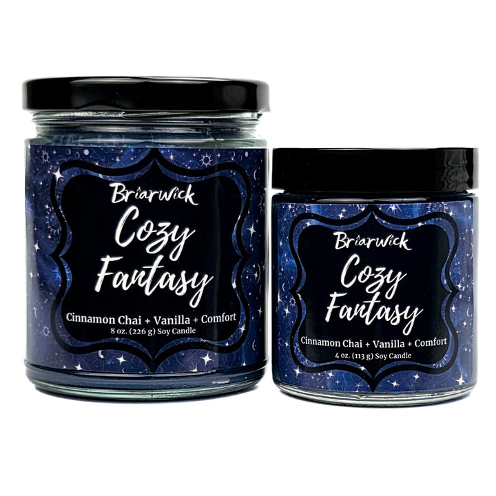 Cozy Fantasy 8oz & 4oz navy candles with blue constellation patterns on a white background