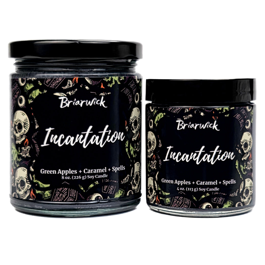 Incantation 8oz & 4oz black candles with witchy skull patterns on a white background
