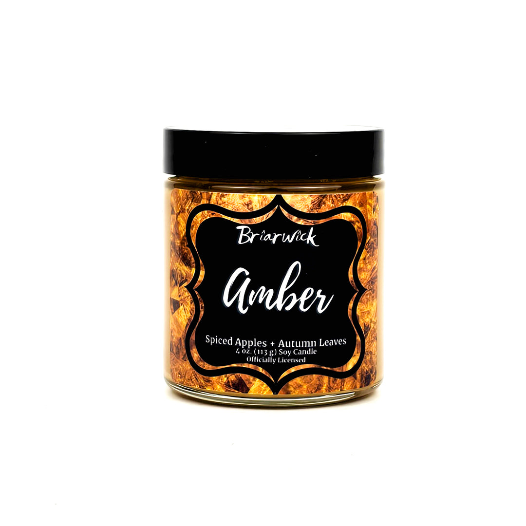 a jar of orange colored food on a white background