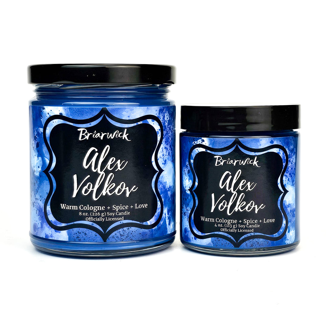 two jars of blue colored wax with black lids