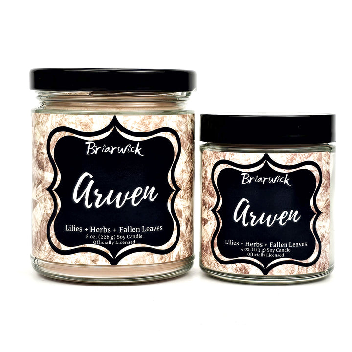 two jars with labels on them sitting next to each other