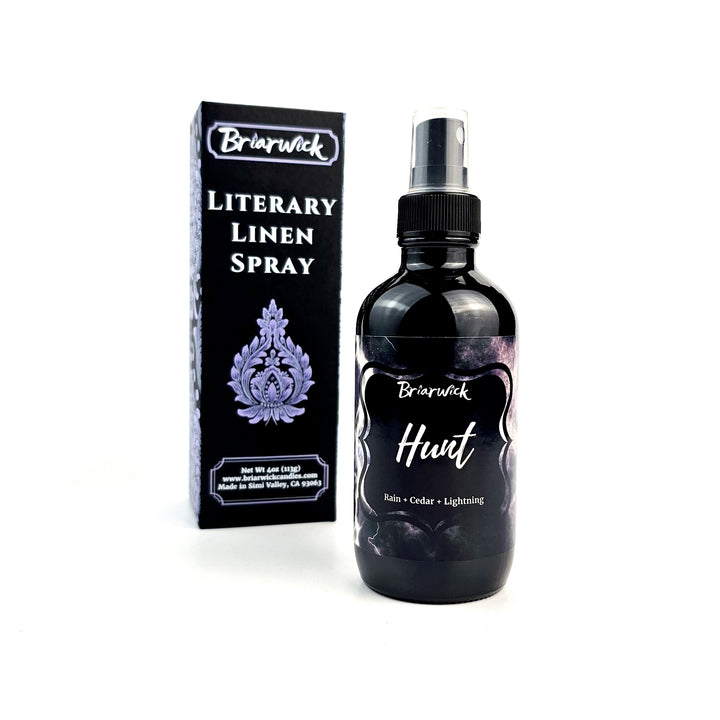 a bottle of liquid sitting next to a box