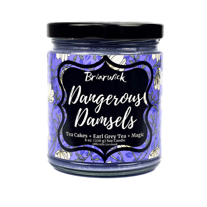 purple 8 oz glass jar candle with floral label called Dangerous Damsels on a white background
