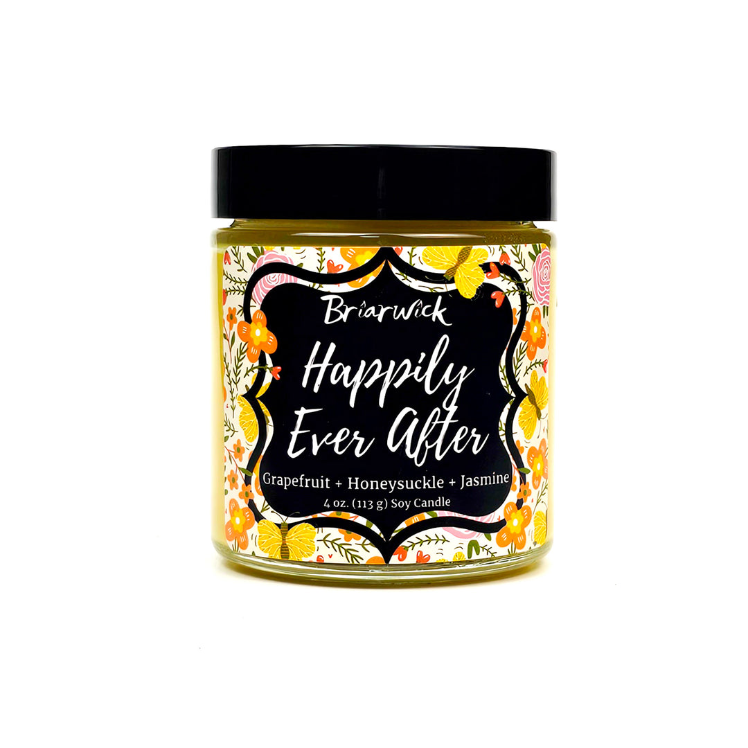Happily Ever After 4oz dandelion yellow candle with floral design on a white background