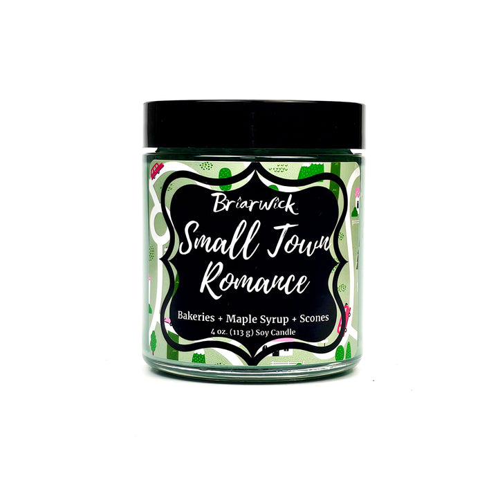 Small Town Romance 4oz pastel green candle with green map design on a white background