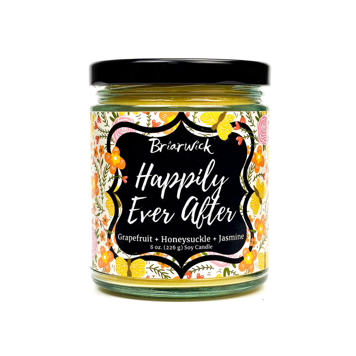 Happily Ever After 8oz dandelion yellow candle with floral design on a white background