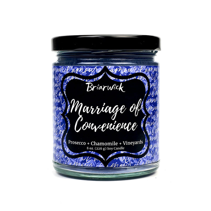Marriage of Convenience 8oz purple candle with purple handwriting design on a white background