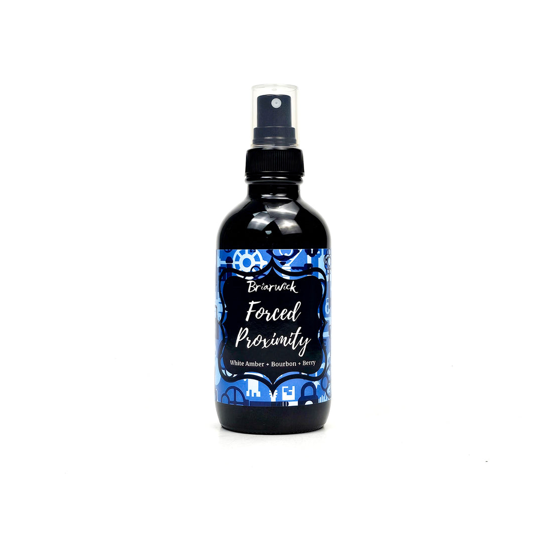 Forced Proximity 4oz Linen Spray with blue lock & key design on a white background