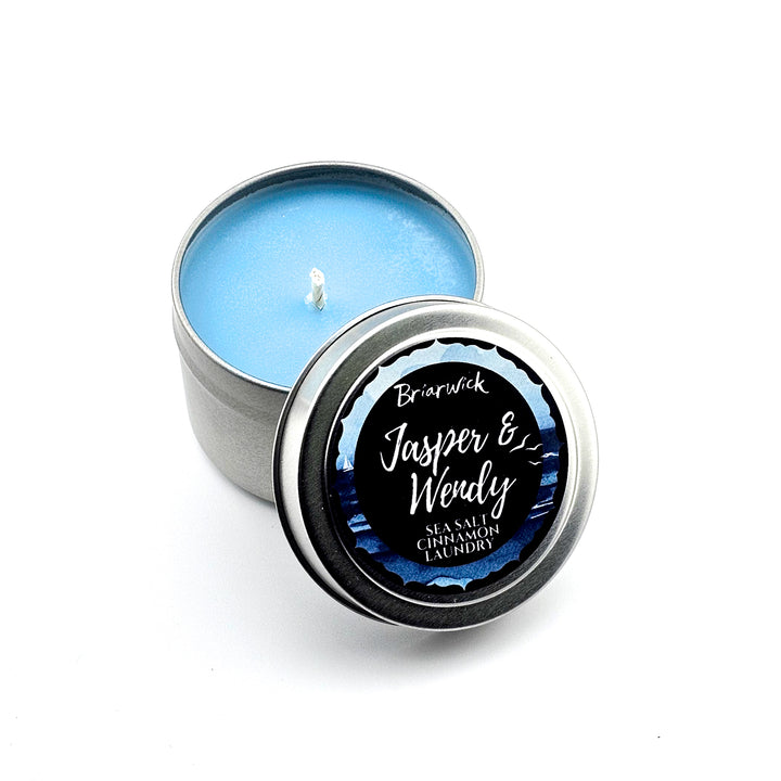 a tin with a candle inside of it