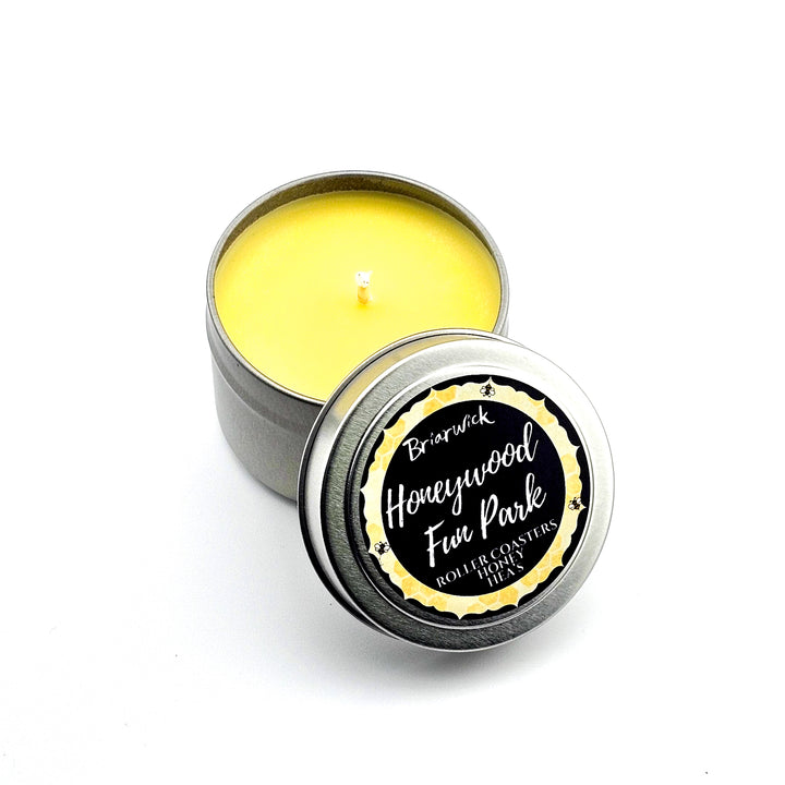 a tin with a candle inside of it