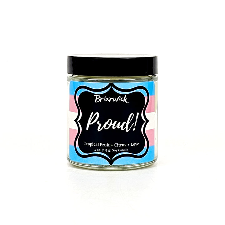 PROUD! 4oz white candle with transgender pride flag on a white background