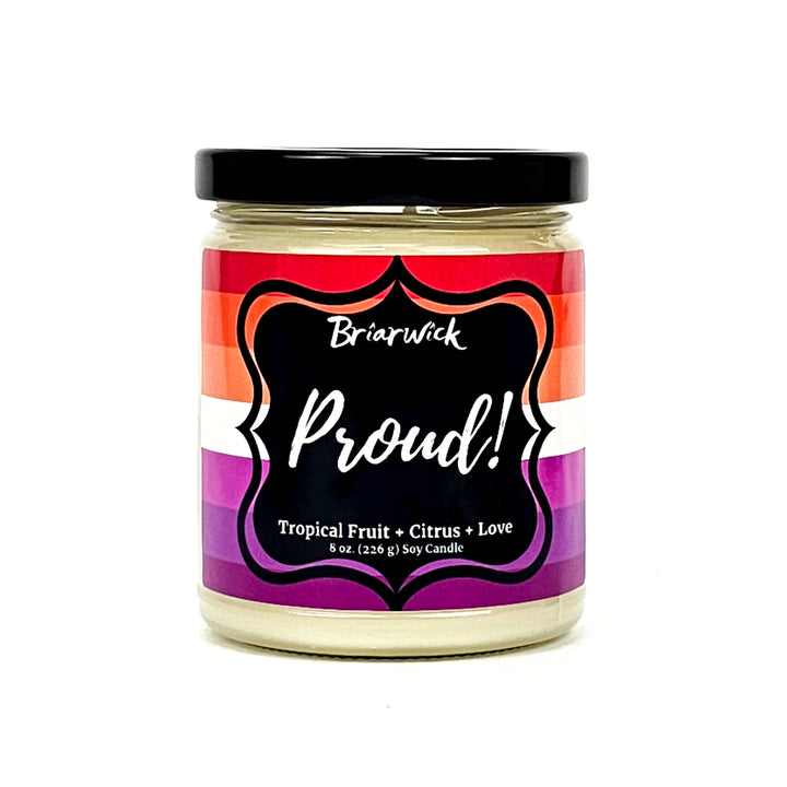 PROUD! 8oz white candle with lesbian pride flag on a white background