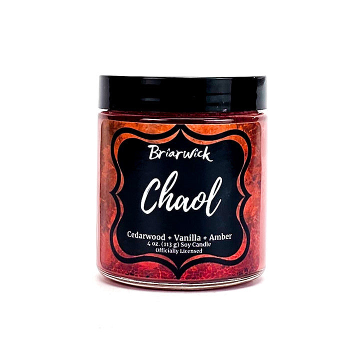 Chaol 4oz burnt orange candle with orange textured design on a white background