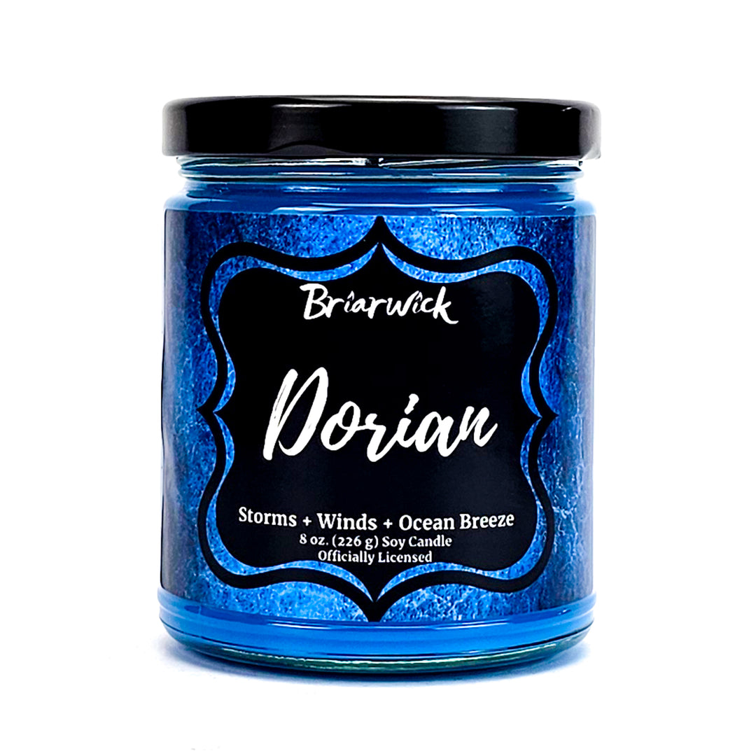 Dorian 8oz cobalt candle with blue textured design on a white background