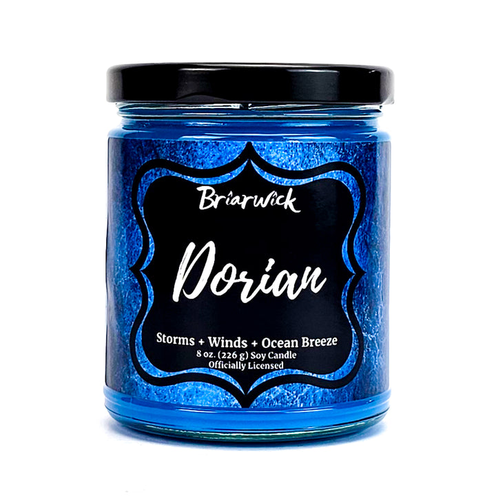 Dorian 8oz cobalt candle with blue textured design on a white background
