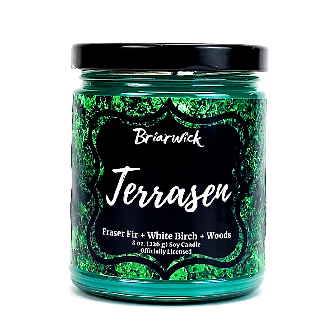 Terrasen 8oz forest green candle with green textured design on a white background