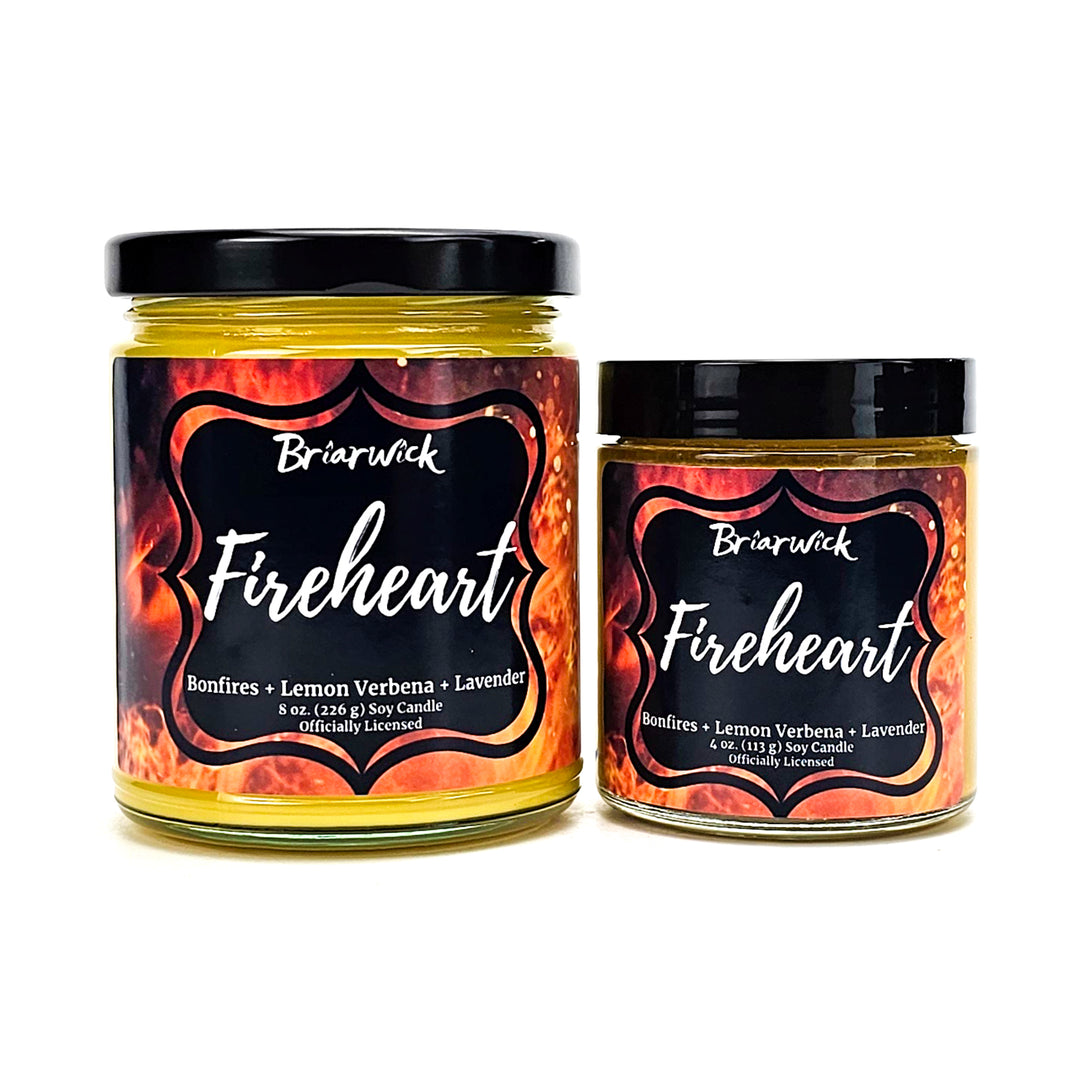 Fireheart 8oz & 4oz canary yellow candles with orange flame designs on a white background