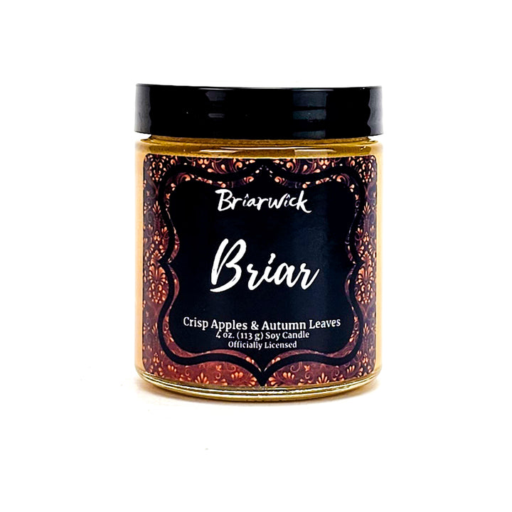 Briar 4oz custard candle with yellow ornamental design on a white background