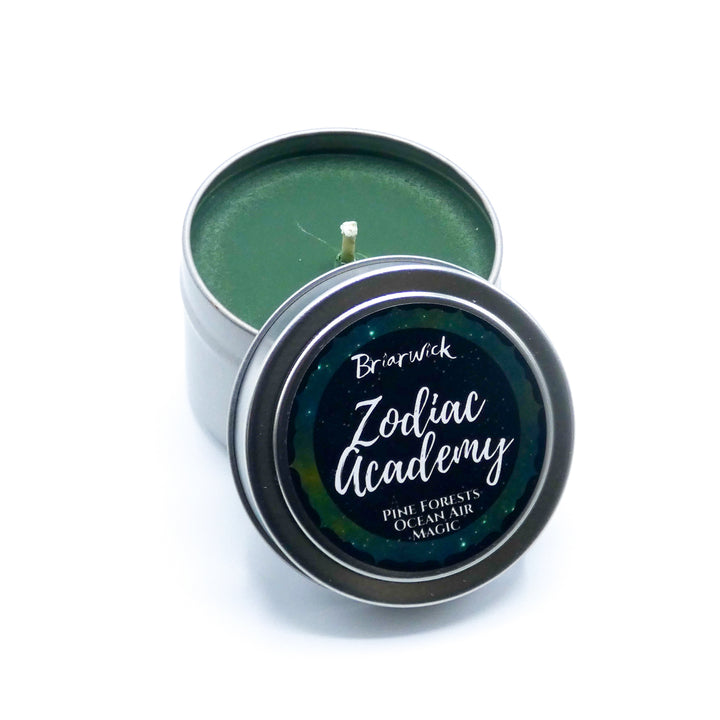 a small tin with a candle inside of it