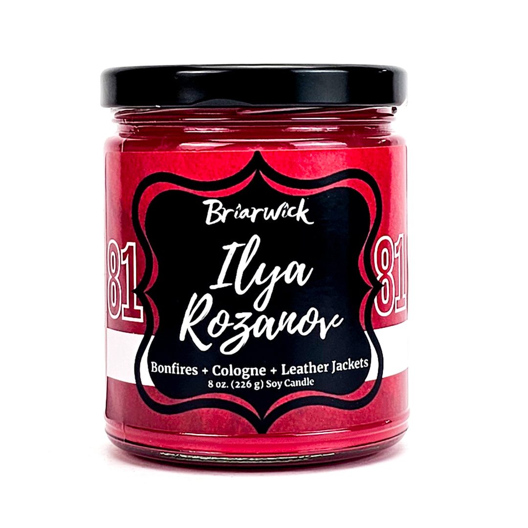 Ilya Rozanov 8oz cherry red candle with red hockey jersey design on a white background