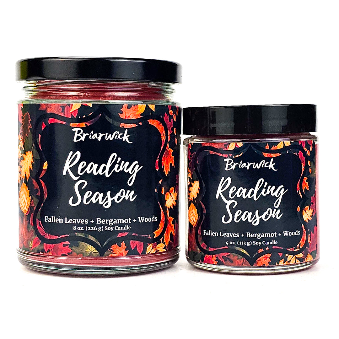 two jars of reading season candles on a white background