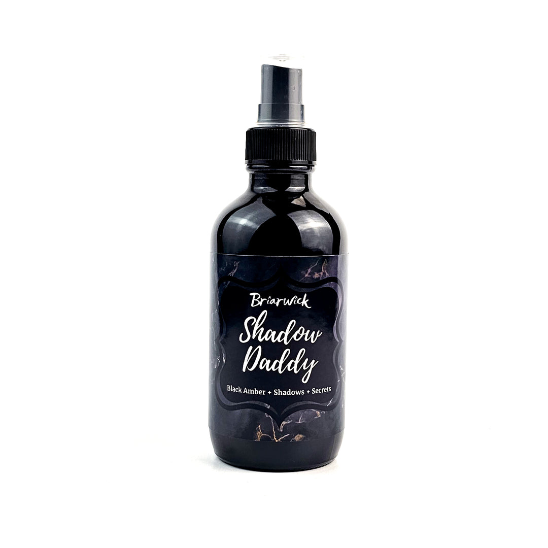 a bottle of black liquid on a white background