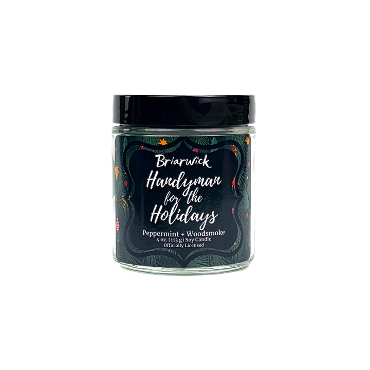 Green 4 oz candle jar labeled 'Handyman for the Holidays' by Briarwick on a white background