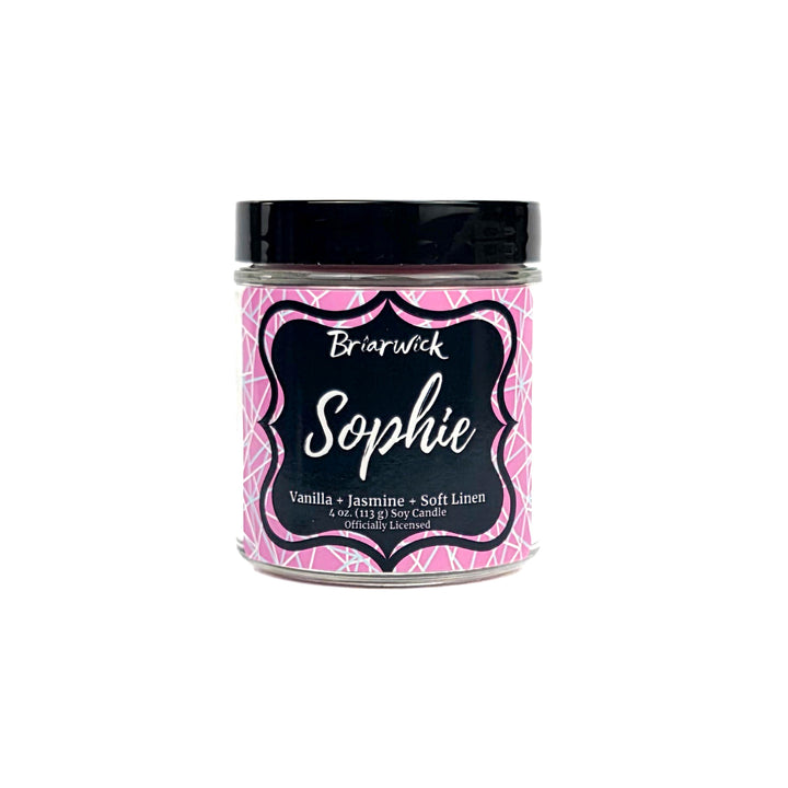 Jar of Briarwick Sophie candle with pink geometric design on a white background
