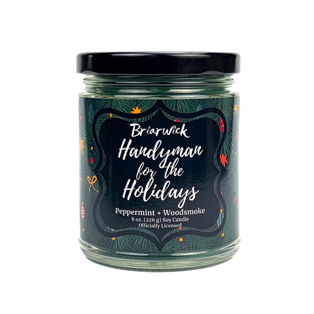 Green 8oz candle jar labeled 'Handyman for the Holidays' by Briarwick on a white background