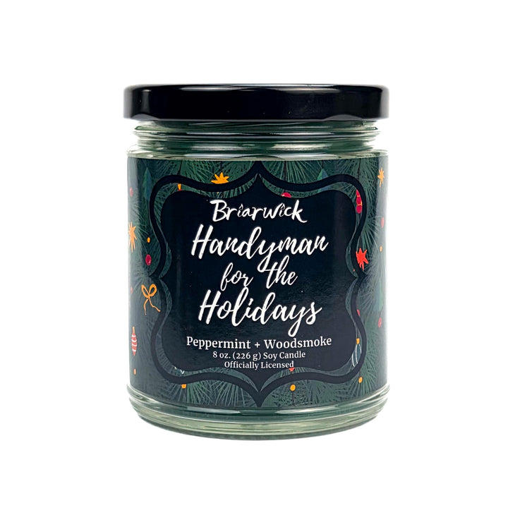 Green 8oz candle jar labeled 'Handyman for the Holidays' by Briarwick on a white background
