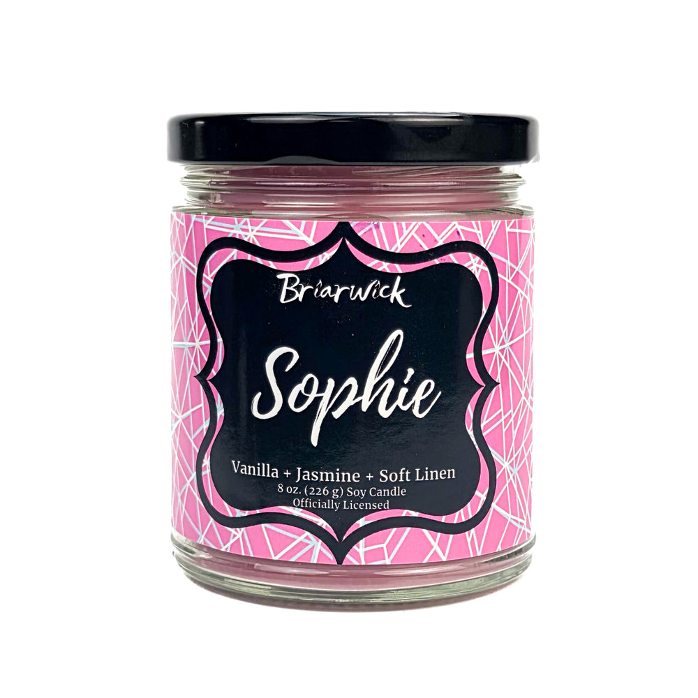 Candle jar with a pink label featuring the name 'Sophie' and branding details.