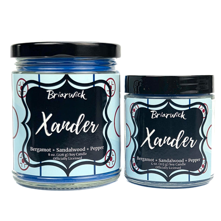 Two Briarwick Xander candles with blue hockey labels on a white background