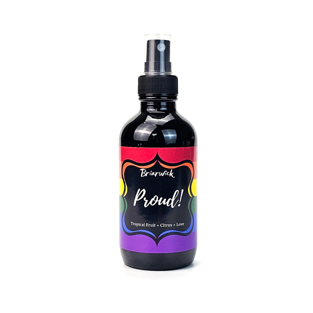 PROUD! 4oz Linen Spray with rainbow pride flag on a white background