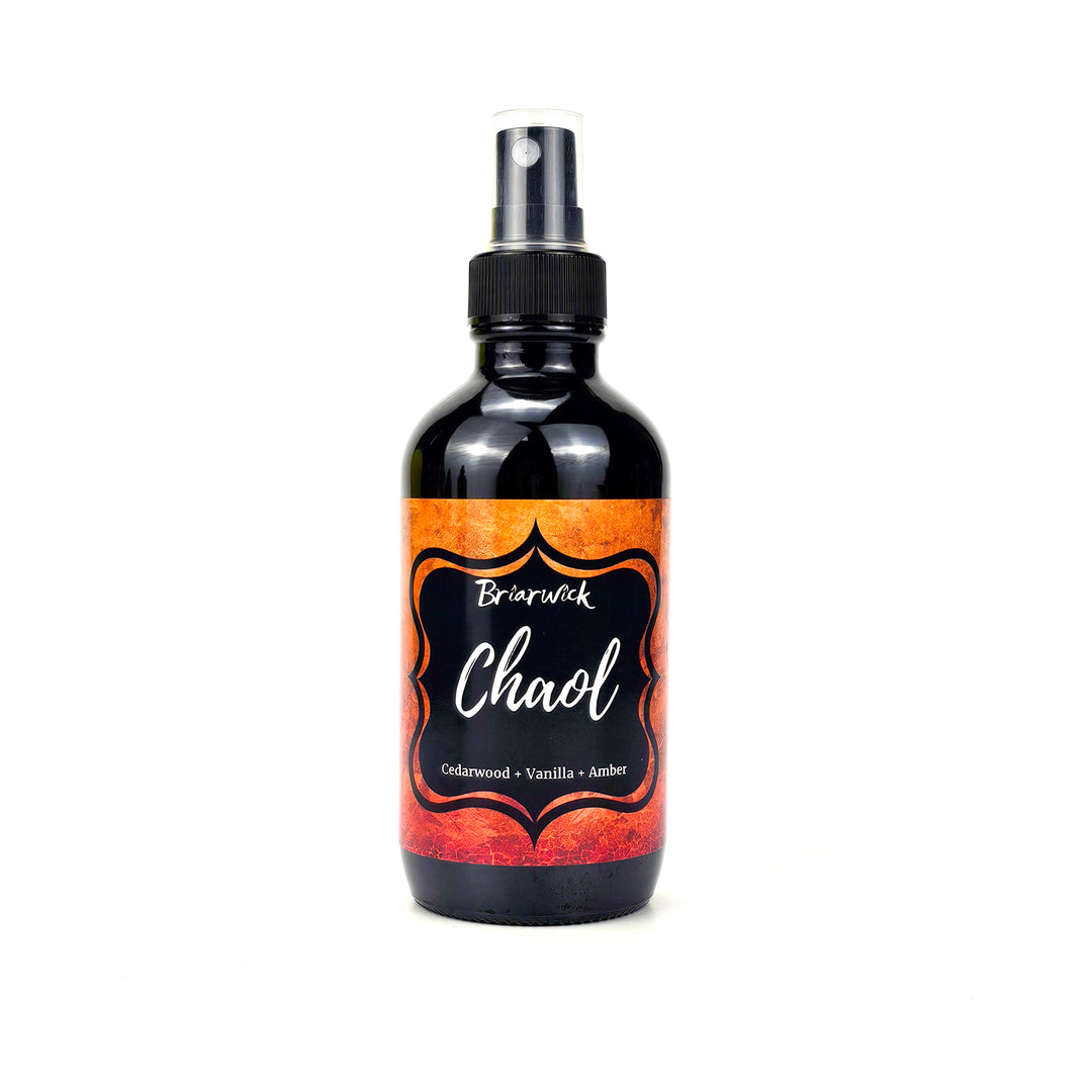 Chaol 4oz Linen Spray candle with orange textured design on a white background