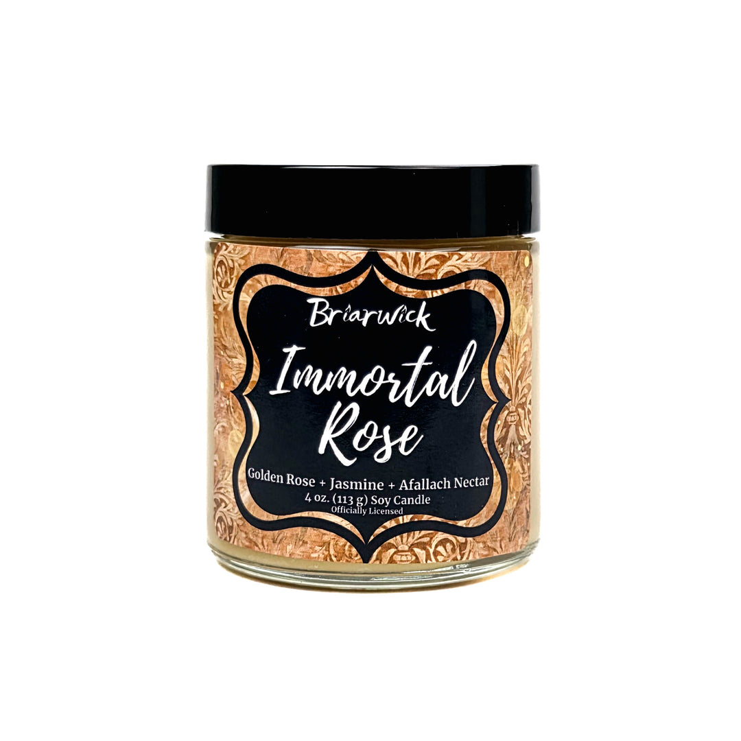 A jar candle labeled 'Briarwick Immortal Rose' with a black lid and a decorative label featuring a gold rose pattern on a white background.