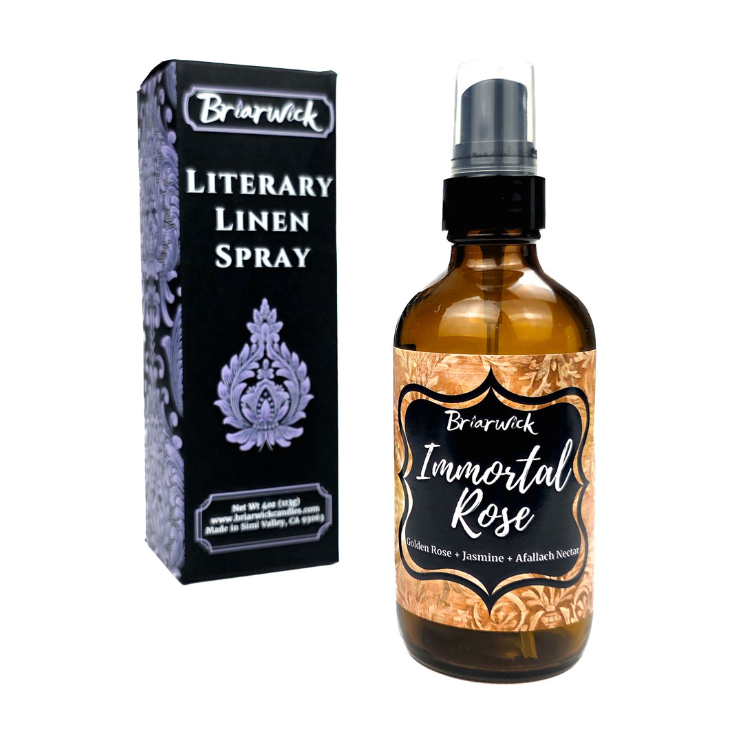 Briarwick Literary Linen Spray bottle and packaging box on a white background. The amber glass spray bottle has a black spray cap and a decorative label reading 'Immortal Rose'.