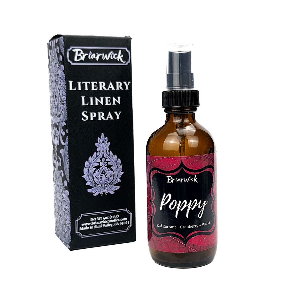 Poppy linen spray with red leaf design on a white background