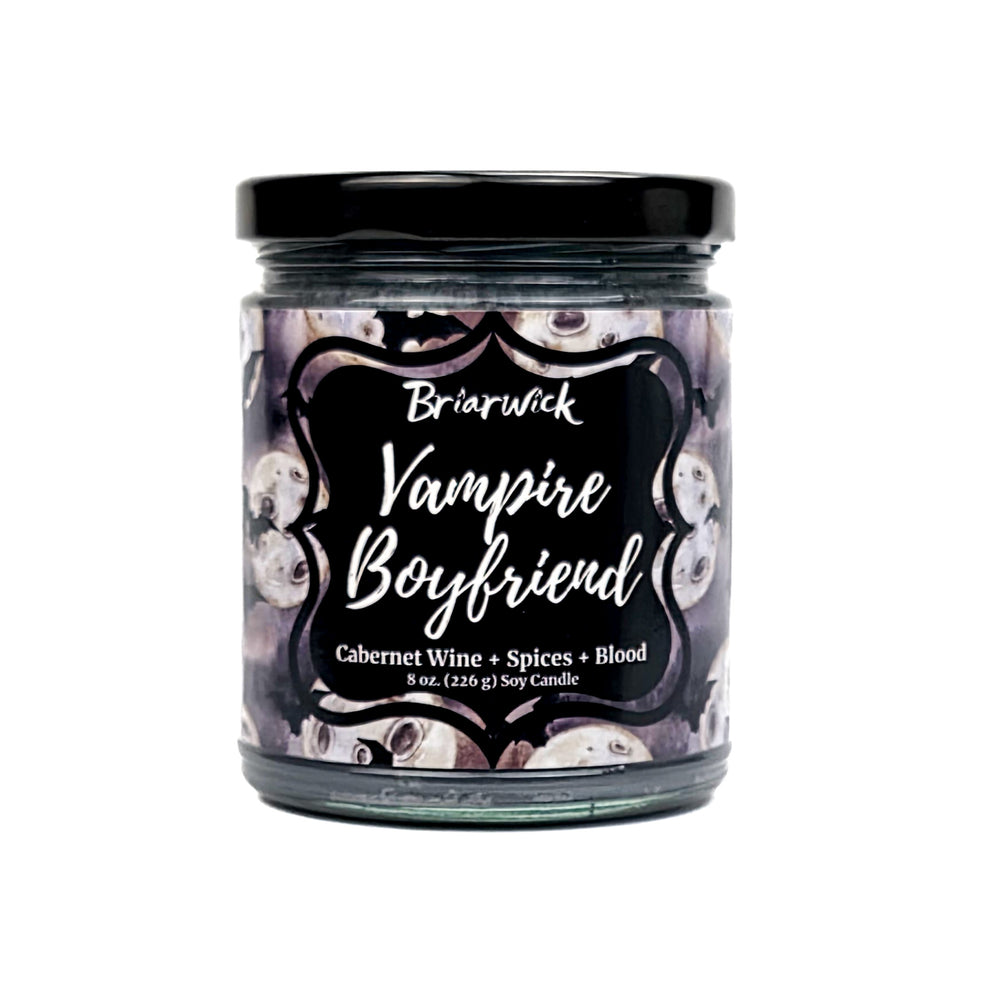 Vampire Boyfriend 8oz flint gray candle with a bat & moon pattern on a white background