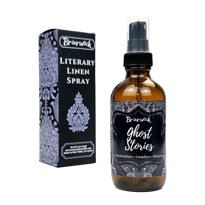 Briarwick Literary Linen Spray shown with its black and lavender packaging box next to the amber glass spray bottle on a white background.