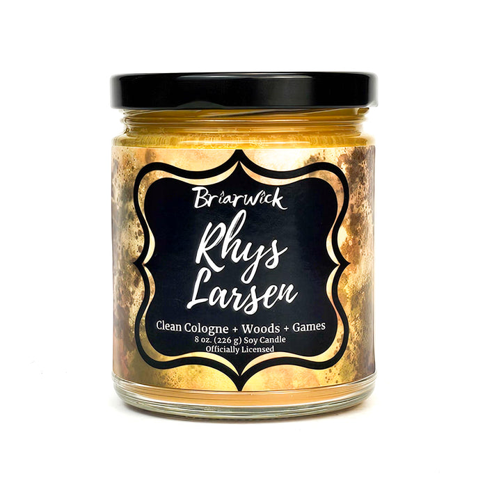 Rhys Larsen 8oz yellow mustard candle with yellow textural design on a white background
