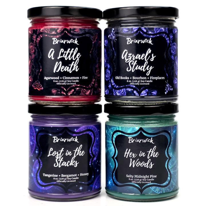 Four 8oz Briarwick candles in jars with colorful labels on a white background
