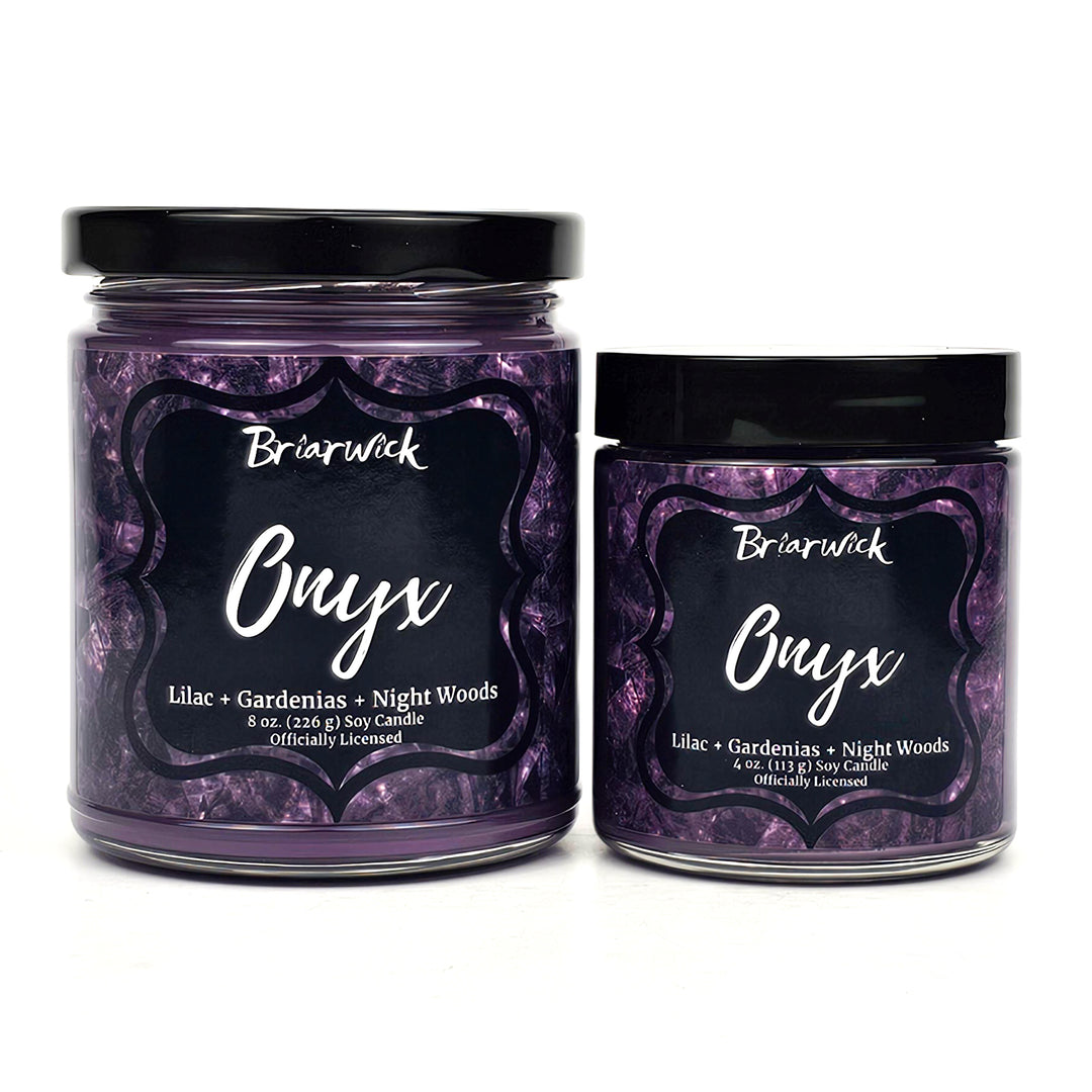 a couple of jars of purple stuff on a white surface