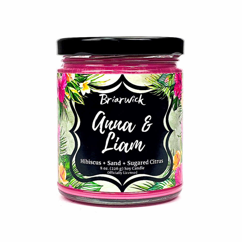 Anna & Liam 8oz hot pink candle with green tropical design on a white background