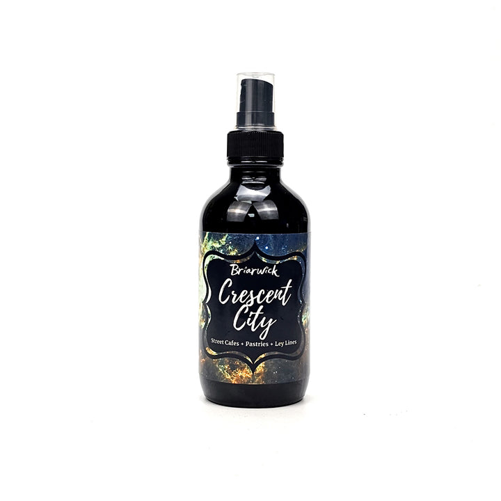 Crescent City 4oz Linen Spray candle with yellow galaxy design on a white background