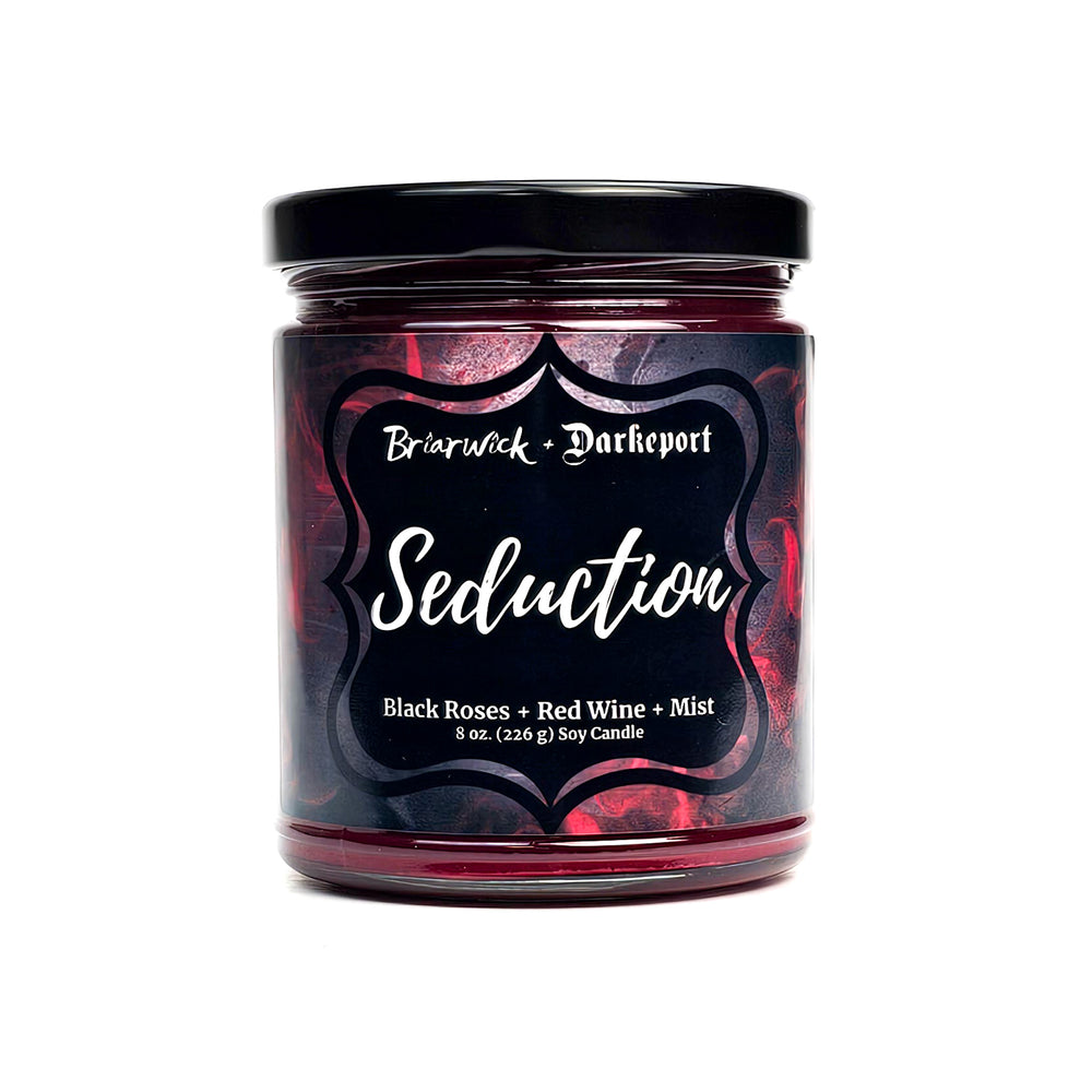 Seduction 8oz blood red candle with red textural design on a white background