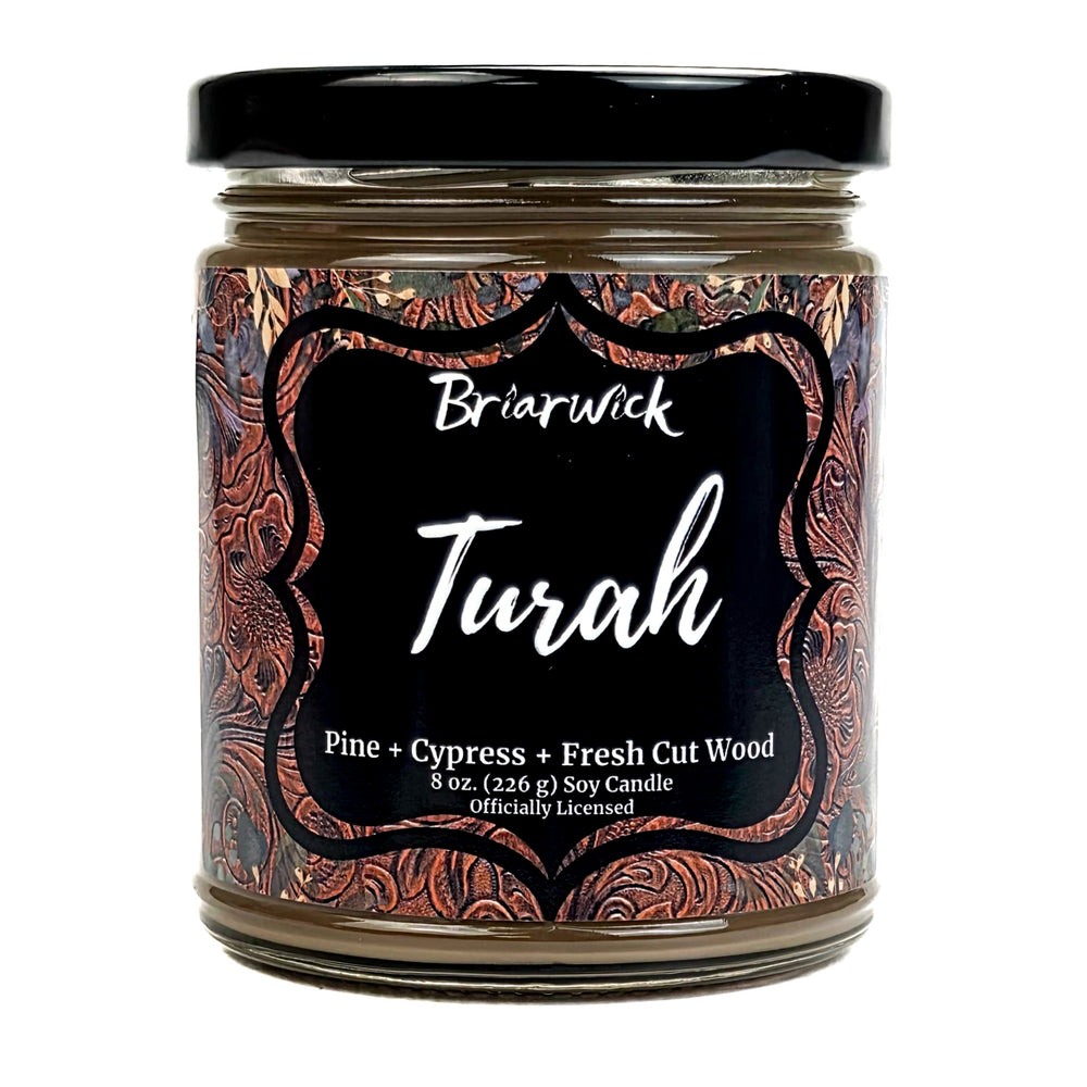 Jar of Briarwick Turah candle with decorative label on a white background